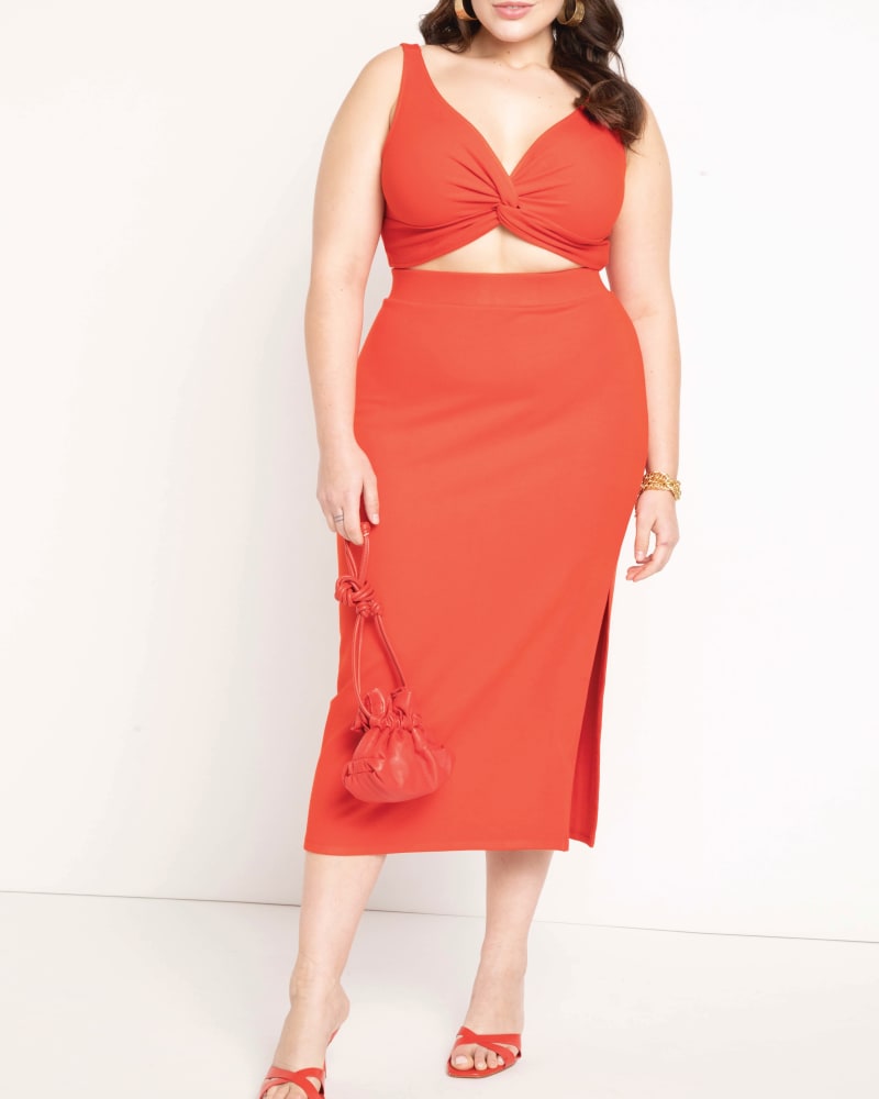 Front of a model wearing a size 14/16 Parker Knit Midi Skirt in High Risk Red by ELOQUII. | dia_product_style_image_id:204200